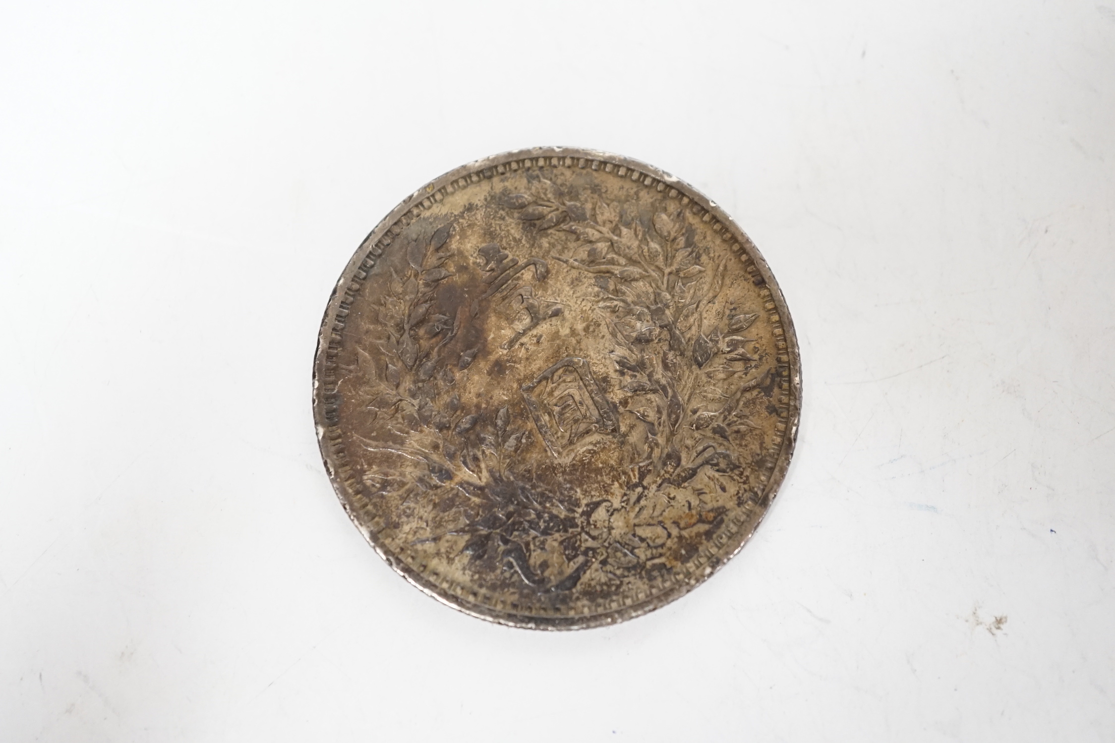 A Chinese Republic period one dollar 1920, and two Chinese Guangxu period coins mounted as miniature furniture, table 4vm higher